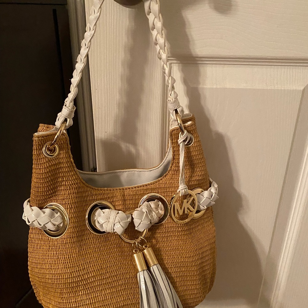 Michael Kors hand bag. White strap and gold accents